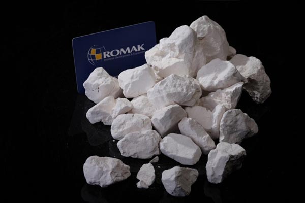 Romak Trading lump lime mineral with romak trading flag white bright
