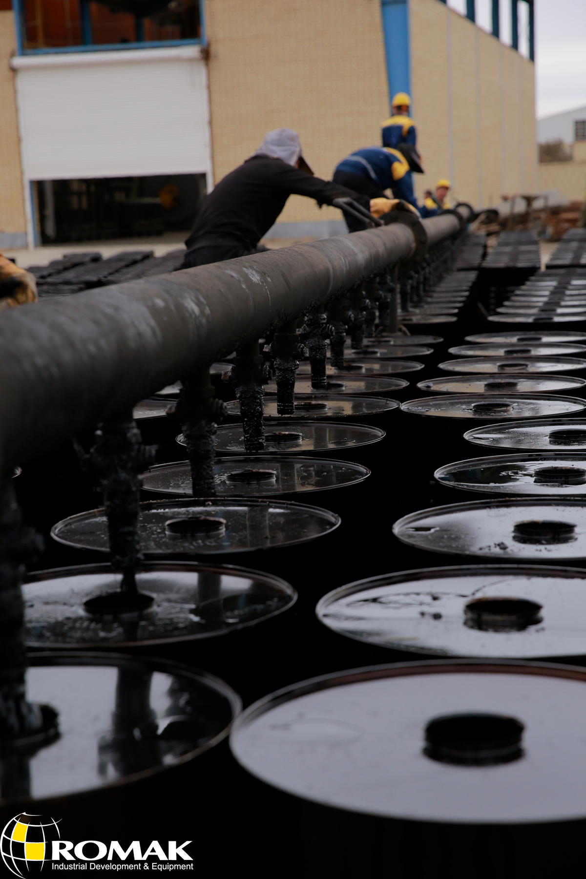 Iran Bitumen being applied for waterproofing in industrial construction projects.