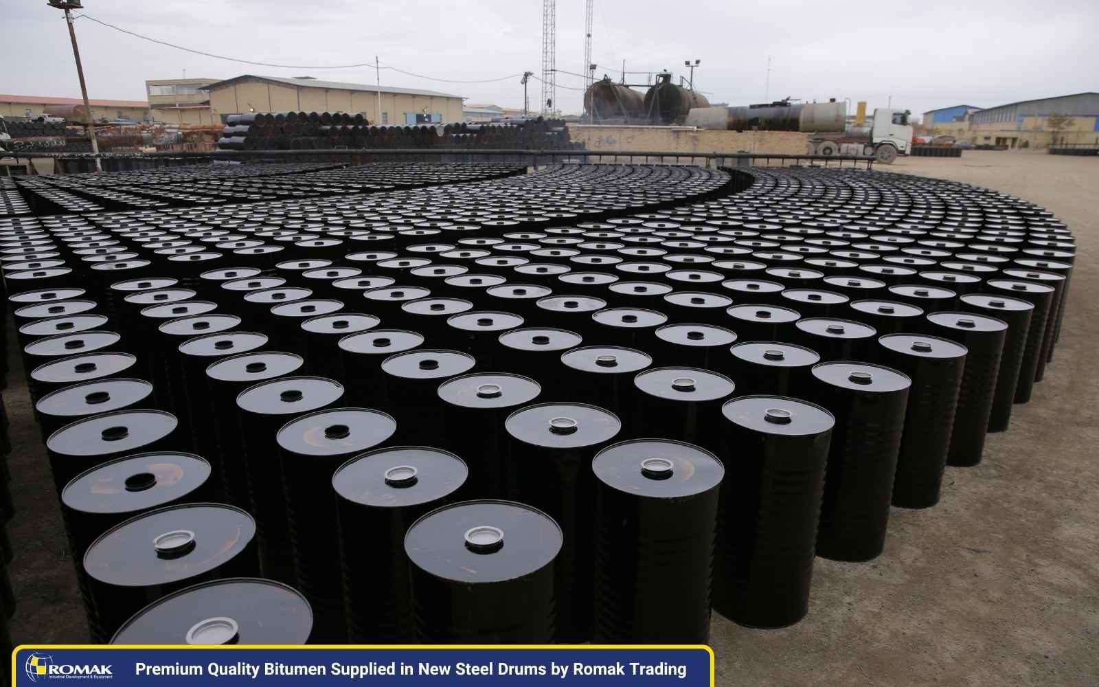 New steel drums filled with premium quality bitumen supplied by Romak Trading, prepared for export to meet global Iran Bitumen Needs.