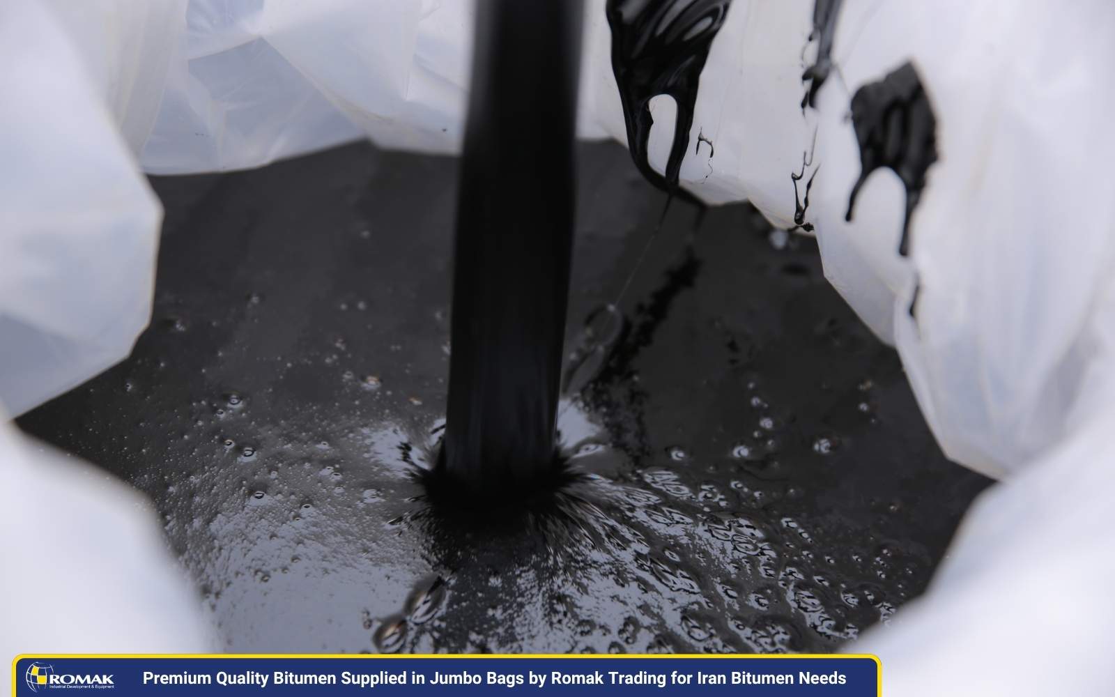 Premium quality bitumen being filled into jumbo bags by Romak Trading, ensuring safe packaging for various Iran Bitumen Needs.